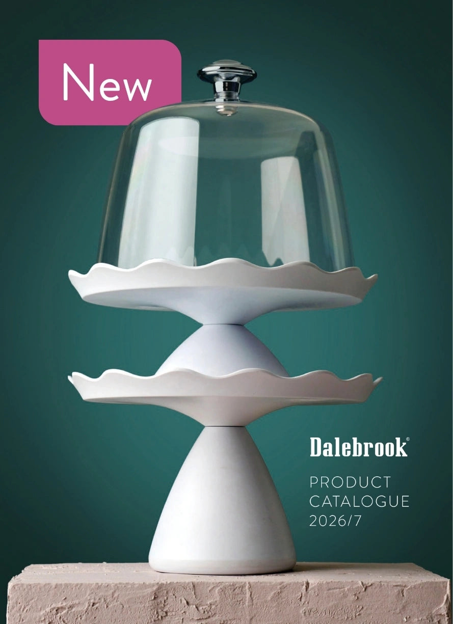 Stacked Dalebrook Loom cake stands topped with a clear cake dome, styled as the cover image for the 2026 product catalogue.