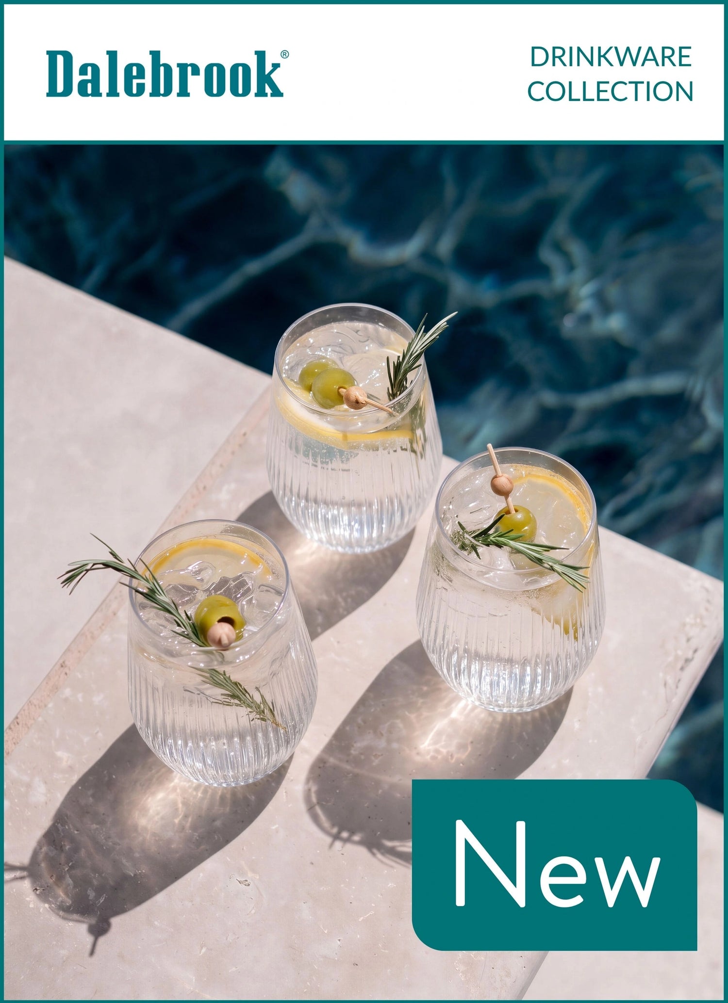 Three clear ribbed cocktail glasses with lemon slices, olives, and rosemary garnish, arranged on a light stone surface beside a blue pool. Dalebrook branding appears at the top, with 'Drinkware Collection' and a 'New' badge.