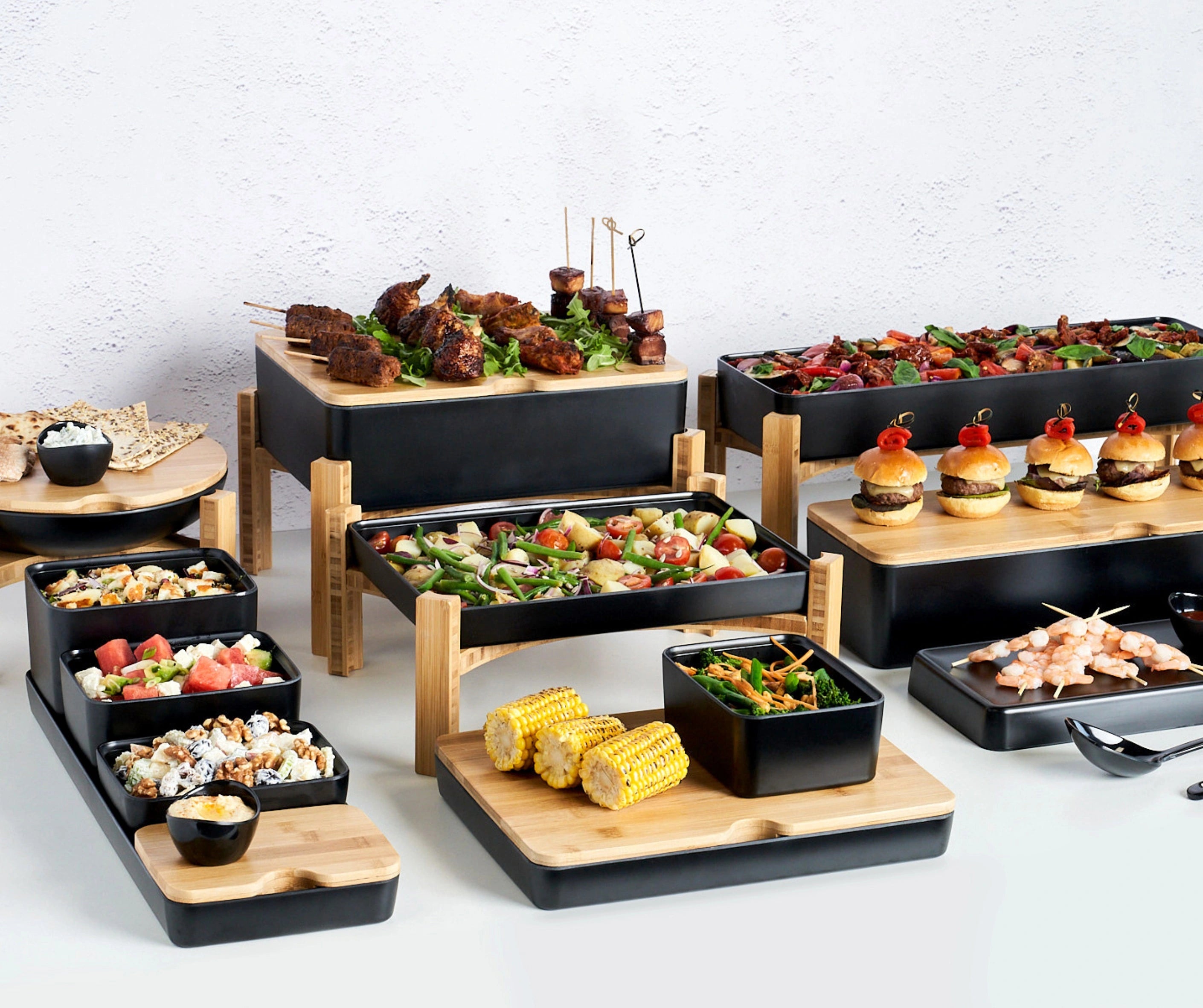 Assorted food platters on a white background, expertly designed displays